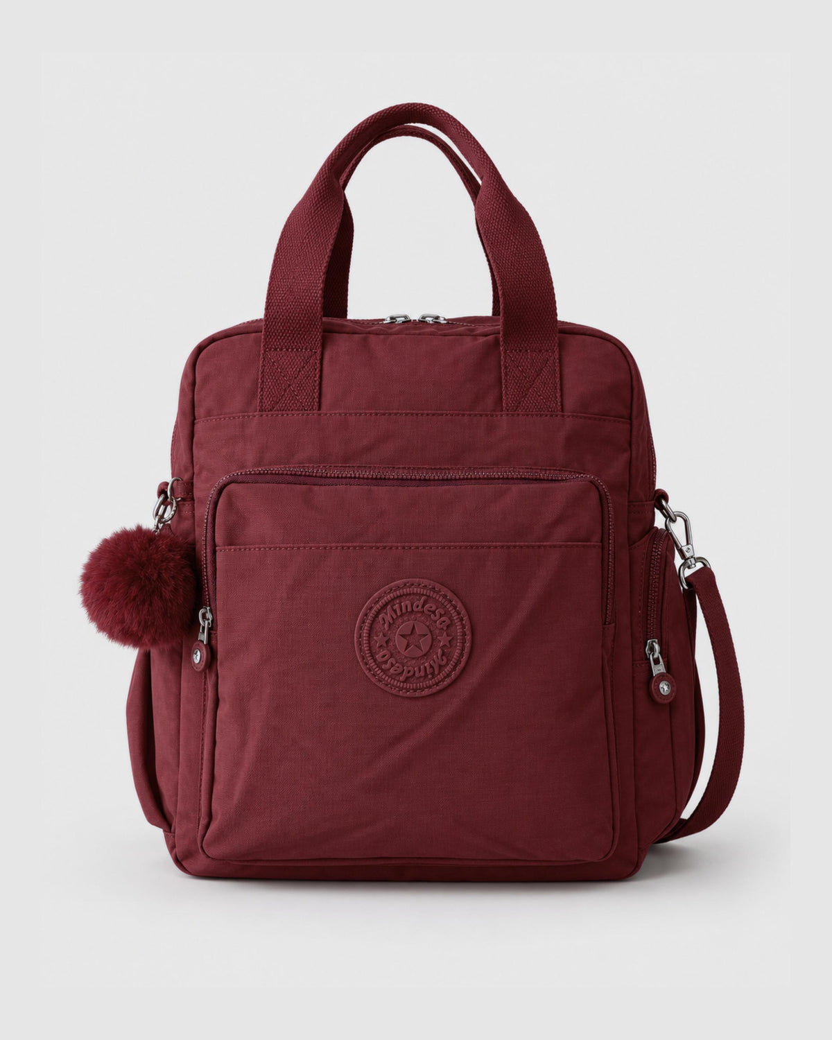 Bolso mochila 3 en 1 de tela nylon con textura de tela mojada, estructurada. Con espacio para laptop de 15.6" 
