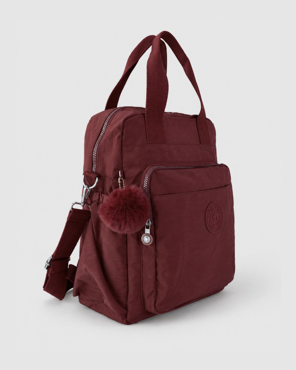 Bolso mochila 3 en 1 de tela nylon con textura de tela mojada, estructurada. Con espacio para laptop de 15.6" 