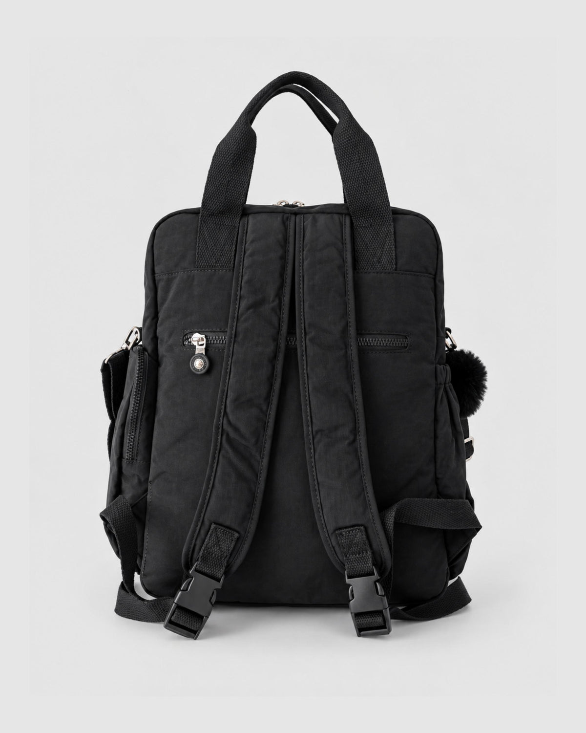 Bolso mochila 3 en 1 de tela nylon con textura de tela mojada, estructurada. Con espacio para laptop de 15.6" 