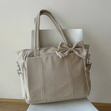Bolso puffer oficio con lazo