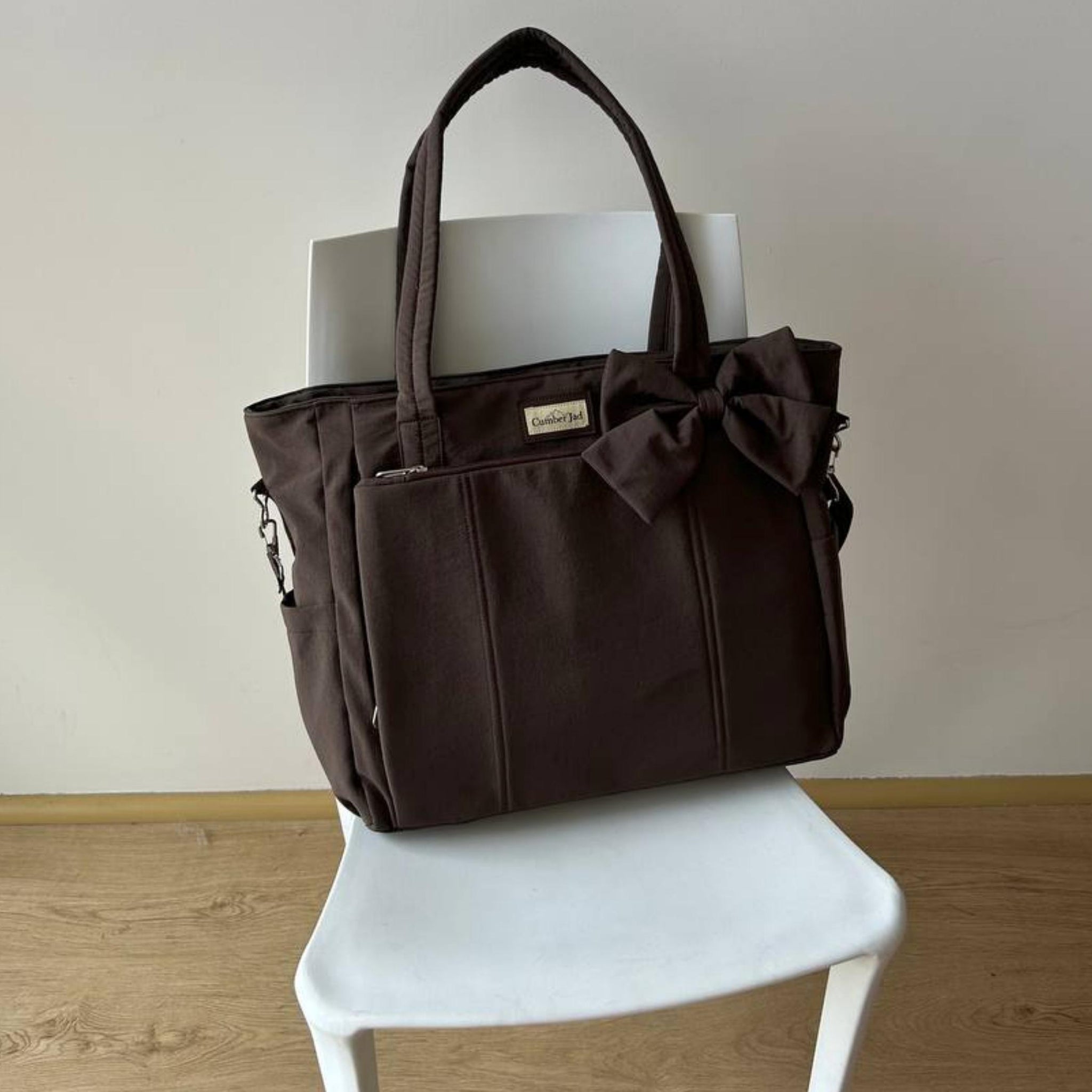 Bolso puffer oficio con lazo