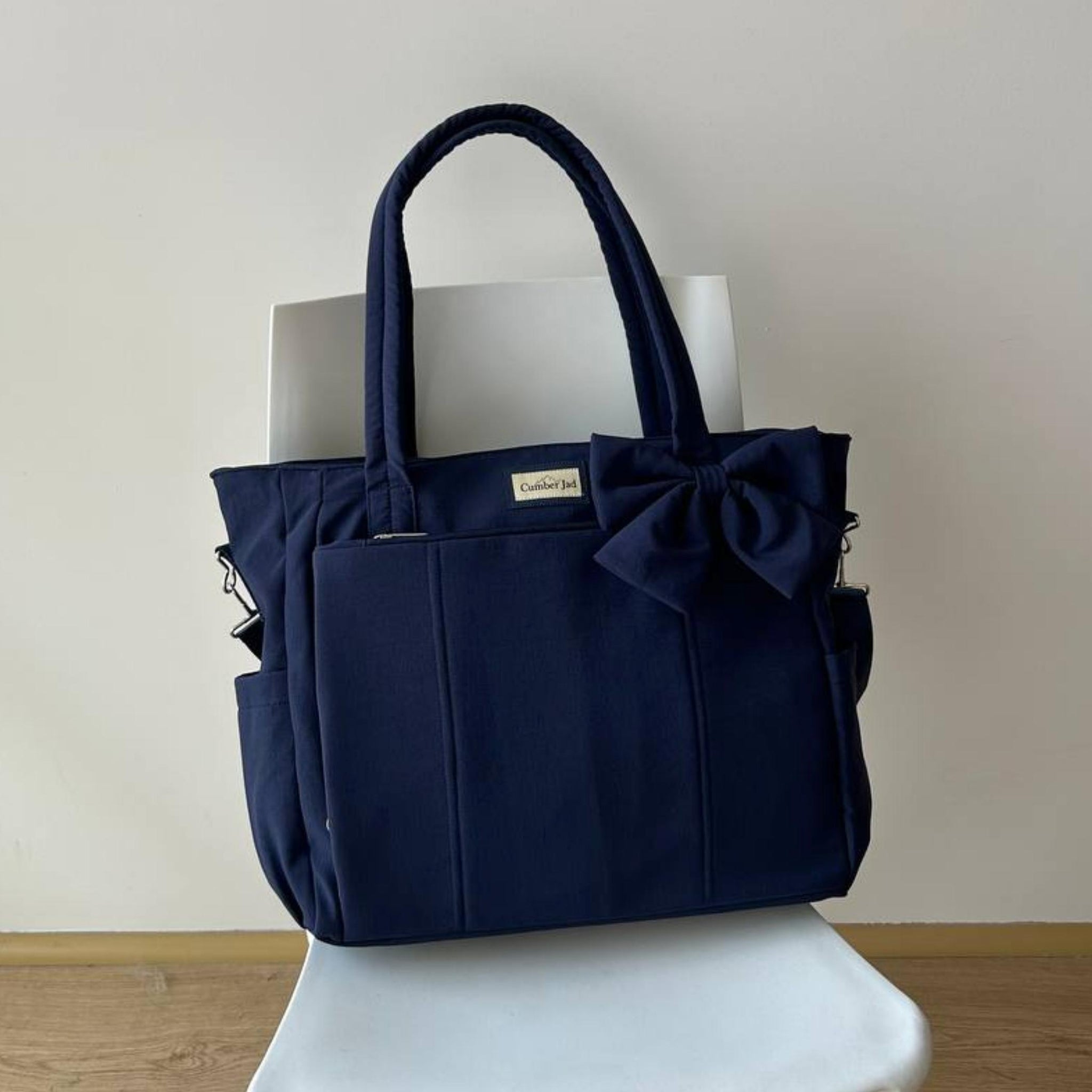 Bolso puffer oficio con lazo